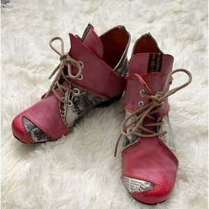Pink with “newspaper” print lace up booties